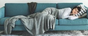 61552297a7fbdd431cf2c734 person-sleeping-on-a-couch