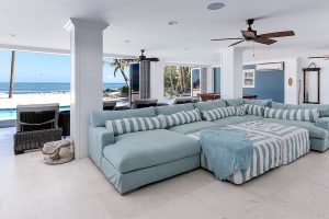 Exquisite-beach-style-home-theater-with-a-view-of-the-ocean-outside
