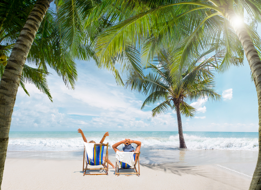 Couple of tourists on the beach in Thailand