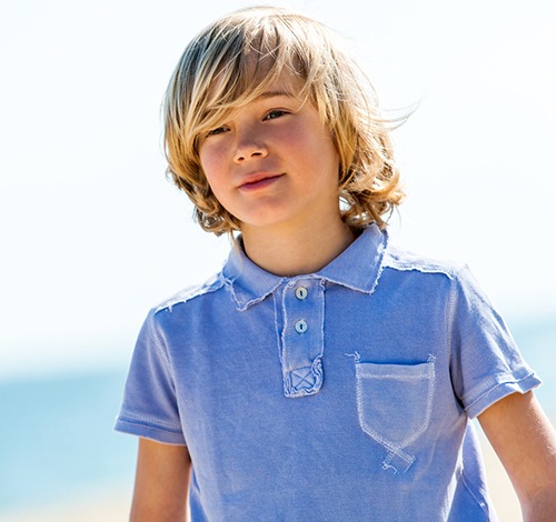 portrait-of-boy-wearing-worn-pol