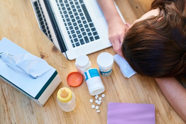 top-view-sick-woman-with-laptop